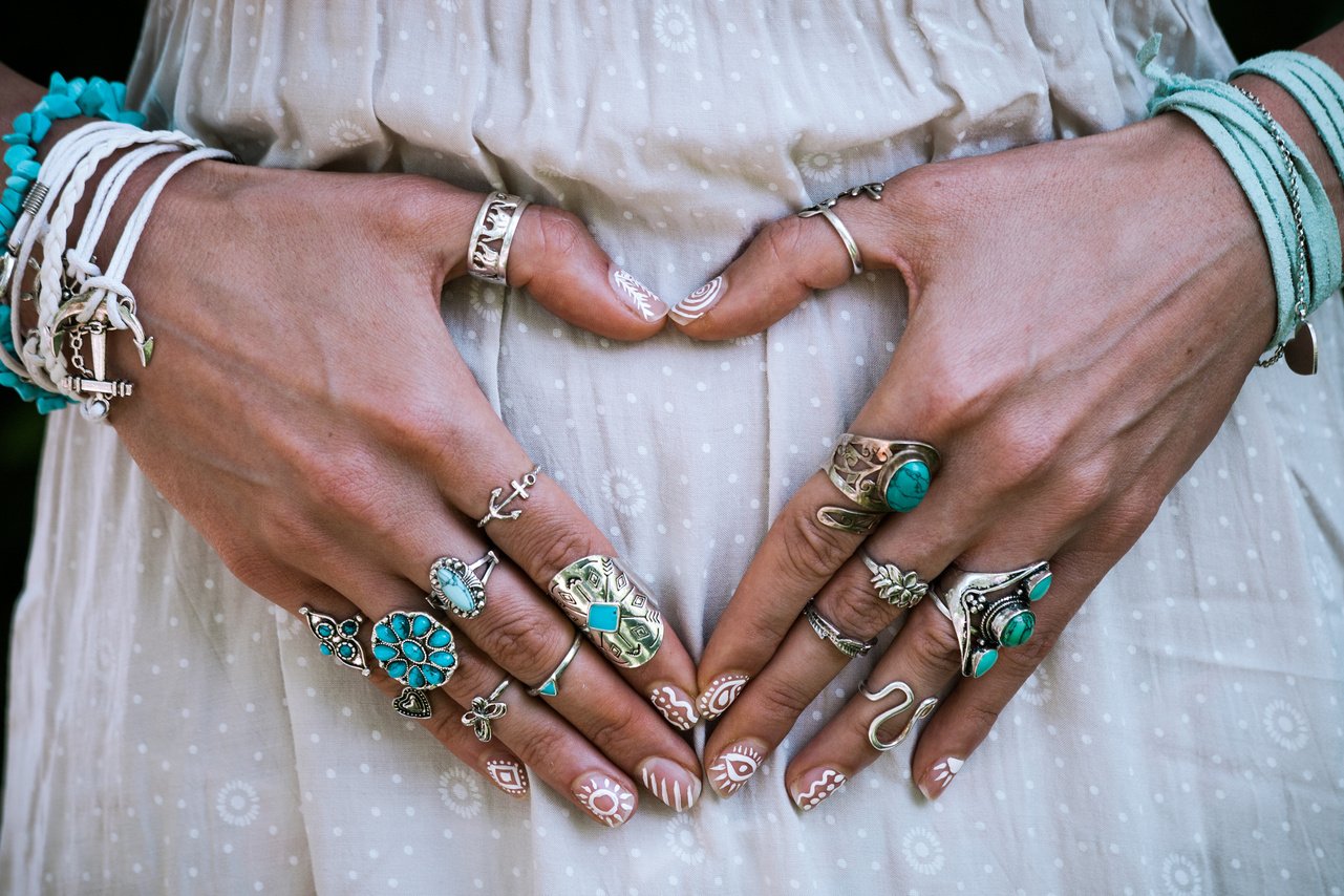 hand with lot of boho style jewerly