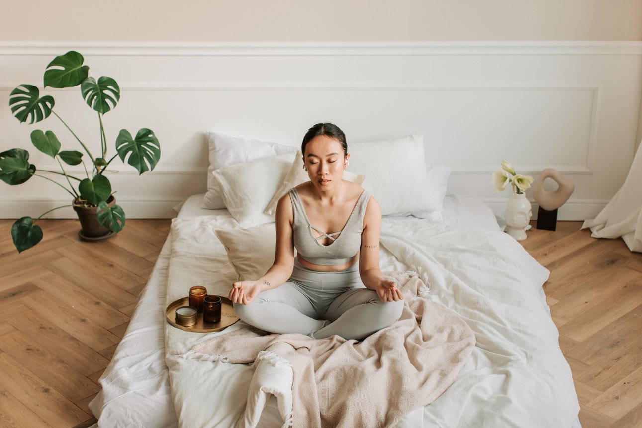 Woman Meditating at Home